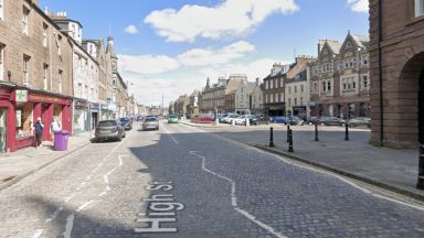 Three arrested after man found injured at property on Montrose High Street